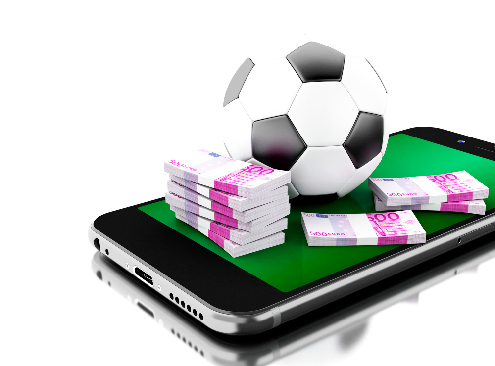 Smartphone with football and money on its screen